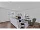 Spacious living room with modern decor, hardwood floors, a fireplace, and plenty of natural light at 128 Cherry Birch St, Mooresville, NC 28117