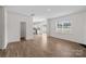 Open-concept living area with hardwood floors, access to kitchen, and ample natural light at 128 Cherry Birch St, Mooresville, NC 28117