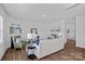 Cozy living room with hardwood floors, a fireplace, modern decor, and a comfortable seating arrangement at 128 Cherry Birch St, Mooresville, NC 28117