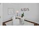 Well-lit home office with white walls, contemporary art, and a modern desk setup with a comfortable chair at 128 Cherry Birch St, Mooresville, NC 28117