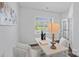 Bright home office with white walls, a large window, and a stylish desk featuring decor and a comfortable chair at 128 Cherry Birch St, Mooresville, NC 28117