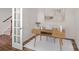 A clean and bright home office featuring wood-look flooring and natural light at 128 Cherry Birch St, Mooresville, NC 28117