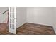 Versatile room with wood-look flooring and white walls, ready for customization at 128 Cherry Birch St, Mooresville, NC 28117