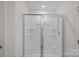 Modern shower with glass door and shelving at 128 Cherry Birch St, Mooresville, NC 28117