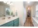 Bright bathroom with a single sink vanity and a shower/tub combo with polka dot curtain at 1308 Stonewyck Dr, Salisbury, NC 28146