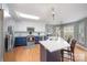 Bright kitchen featuring stainless steel appliances, a center island with seating, and a view of the backyard at 1308 Stonewyck Dr, Salisbury, NC 28146