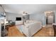 Comfortable living area with hardwood floors, a fireplace, neutral walls, and seamless flow to the rest of the house at 1308 Stonewyck Dr, Salisbury, NC 28146