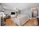 Comfortable living area with hardwood floors, a fireplace, neutral walls, and seamless flow to the rest of the house at 1308 Stonewyck Dr, Salisbury, NC 28146