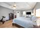 Spacious main bedroom with tray ceiling and a connected full bathroom, featuring modern decor at 1308 Stonewyck Dr, Salisbury, NC 28146