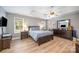 Serene main bedroom with tray ceiling, ceiling fan, and ample natural light at 1308 Stonewyck Dr, Salisbury, NC 28146