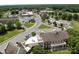 Aerial view of a charming town with tree-lined streets, showcasing the downtown area and local businesses at 146 Kerri Dawn Ln, Locust, NC 28097