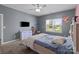 Comfortable bedroom with a ceiling fan, carpet flooring, and lots of natural light at 146 Kerri Dawn Ln, Locust, NC 28097