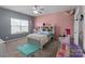 Bedroom featuring a window, a bed, shelves, and decor at 146 Kerri Dawn Ln, Locust, NC 28097