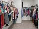 Walk-in closet with organized storage, hanging racks, and shelving for clothing and accessories at 146 Kerri Dawn Ln, Locust, NC 28097
