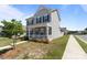 Charming two-story home with a welcoming front porch and manicured lawn in a quiet neighborhood at 146 Kerri Dawn Ln, Locust, NC 28097