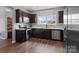 Well-equipped kitchen featuring stainless steel appliances, ample cabinet space, and hardwood floors at 146 Kerri Dawn Ln, Locust, NC 28097