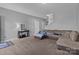 Spacious living room featuring plush carpeting, a large sofa, and neutral decor at 146 Kerri Dawn Ln, Locust, NC 28097