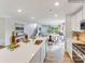 Bright, open kitchen features an island and seamlessly connects the living area at 1539 River Cane St, Edgemoor, SC 29712