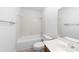 Bright bathroom with a standard shower-tub, toilet, and single sink vanity at 1604 Sharon W Rd, Charlotte, NC 28210