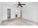Bright bedroom with a ceiling fan and access to the bathroom at 1604 Sharon W Rd, Charlotte, NC 28210