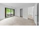 Bedroom with sliding glass doors to deck and closet at 1604 Sharon W Rd, Charlotte, NC 28210
