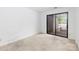 Bright bedroom with sliding glass doors leading to a private deck at 1604 Sharon W Rd, Charlotte, NC 28210