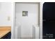 Laundry room with white washer and dryer, and black refrigerator at 1604 Sharon W Rd, Charlotte, NC 28210