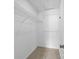Walk-in closet with carpet flooring and wire shelving for storage at 1604 Sharon W Rd, Charlotte, NC 28210