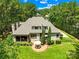 Aerial view of a beautiful house with a private backyard surrounded by lush greenery at 168 Blue Ridge Trl, Mooresville, NC 28117