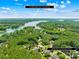 Aerial view of the property showcasing its proximity to Lake Norman and the surrounding lush landscape at 168 Blue Ridge Trl, Mooresville, NC 28117