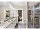 This spacious bathroom features an expansive vanity and a glass enclosed shower at 168 Blue Ridge Trl, Mooresville, NC 28117