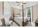 This bedroom features a four poster bed and a view of the surrounding landscape at 168 Blue Ridge Trl, Mooresville, NC 28117