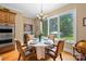 Bright dining area with hardwood floors has large windows overlooking a private backyard at 168 Blue Ridge Trl, Mooresville, NC 28117