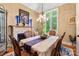 Charming dining room with a fireplace, chandelier, and natural light at 168 Blue Ridge Trl, Mooresville, NC 28117