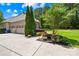 Spacious two-car garage with a concrete driveway, complemented by colorful landscaping and lush green lawn at 168 Blue Ridge Trl, Mooresville, NC 28117
