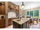 The kitchen has a brick alcove over the range, and custom cabinets at 168 Blue Ridge Trl, Mooresville, NC 28117