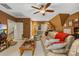 Cozy living room with plush seating, a ceiling fan, and ample lighting at 168 Blue Ridge Trl, Mooresville, NC 28117