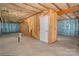 Unfinished basement ready for customization, with framed walls, insulation, concrete flooring, and door at 17513 Hawks View Dr, Fort Mill, SC 29707
