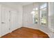 Versatile room featuring hardwood floors, bright windows, and multiple closets at 17513 Hawks View Dr, Fort Mill, SC 29707