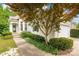 Inviting home exterior with a walkway, well-kept landscaping, and a mature tree in the front yard at 17513 Hawks View Dr, Fort Mill, SC 29707