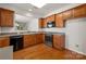 Well-designed kitchen with wood cabinets, stainless steel oven and microwave, offering a practical cooking space at 17513 Hawks View Dr, Fort Mill, SC 29707