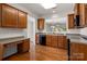 Spacious kitchen with wooden cabinets and a breakfast bar, perfect for casual dining and meal preparation at 17513 Hawks View Dr, Fort Mill, SC 29707