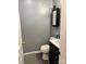 A compact powder room with sleek fixtures, gray paint, and modern toilet is a stylish and convenient space at 1920 Waldeck Ct, Mount Pleasant, NC 28124