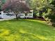 Front yard view of the home showing the manicured lawn and landscaping at 1920 Waldeck Ct, Mount Pleasant, NC 28124