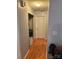 Hallway with laundry closet and light-colored walls at 1920 Waldeck Ct, Mount Pleasant, NC 28124
