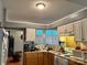 Cozy kitchen with light-colored cabinets, modern appliances, and a bright window at 1920 Waldeck Ct, Mount Pleasant, NC 28124