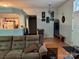 Open concept living room featuring wood floors and lots of natural light at 1920 Waldeck Ct, Mount Pleasant, NC 28124
