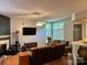 Spacious living room with hardwood floors, a fireplace, and large windows at 1920 Waldeck Ct, Mount Pleasant, NC 28124
