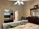 A cozy main bedroom with large closet, ceiling fan, and comfortable bedding provides a relaxing retreat at 1920 Waldeck Ct, Mount Pleasant, NC 28124