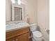 Simple half bathroom with wood vanity and neutral wall color at 2020 Dawnshire Dr, Gastonia, NC 28054